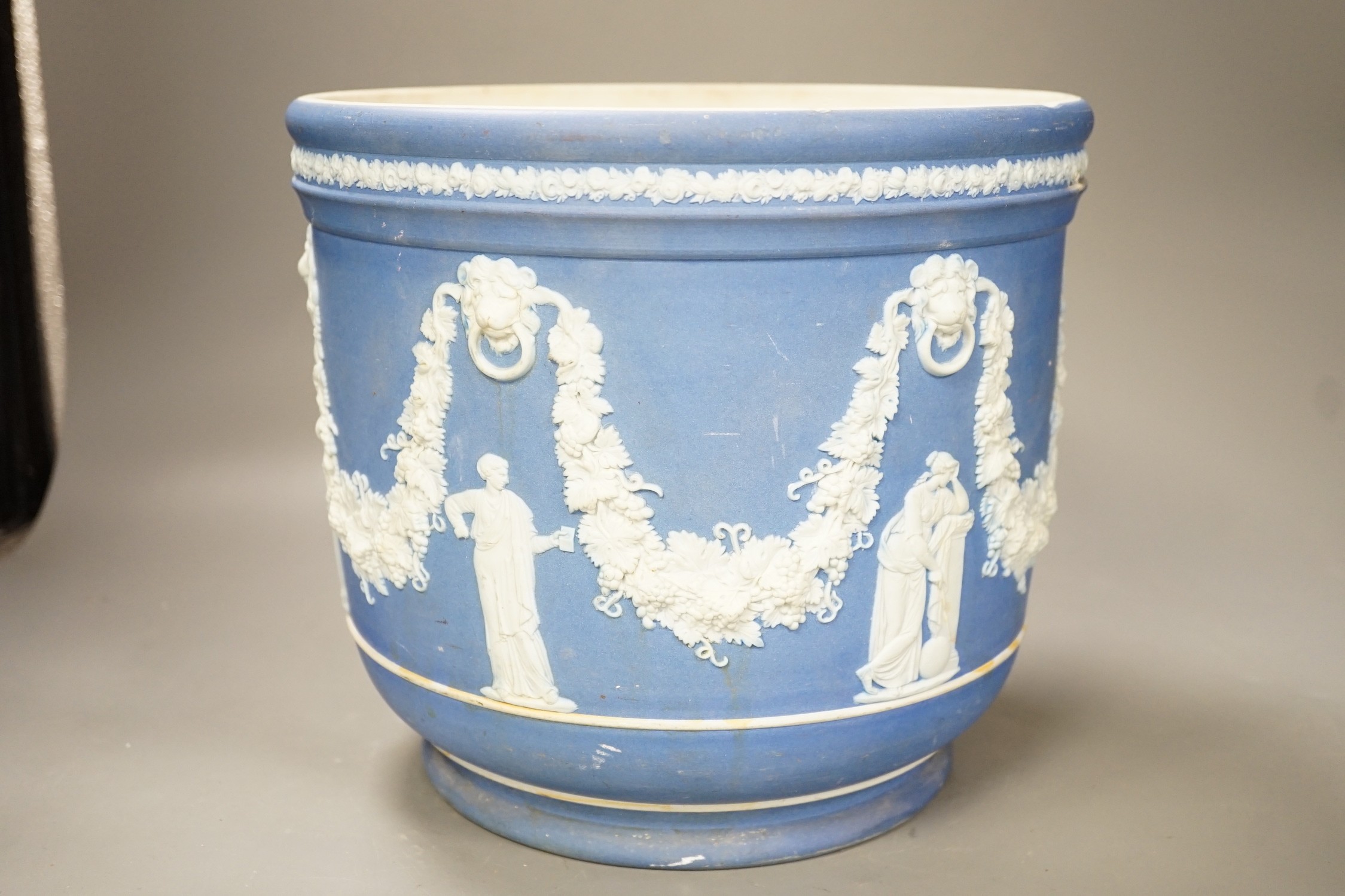 A Wedgwood blue jasper jardiniere, sprigged with muses and swags, height 23cm
